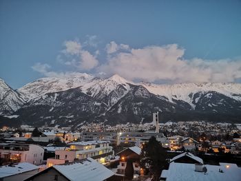 Aerial view of townscape against sky during winter