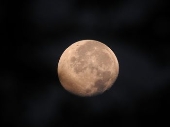 Low angle view of moon against sky at night