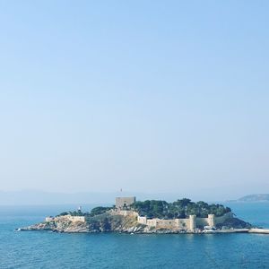 Scenic view of sea against clear blue sky