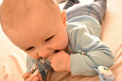 Close-up of boy holding baby