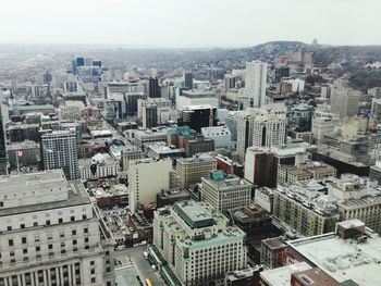 High angle view of buildings in city against sky