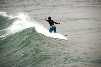 Full length of man surfing in sea