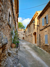 View of narrow street between buildings