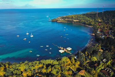 An aerial portrait of senggigi lombok beach during the day. the photo was taken using a drone. 