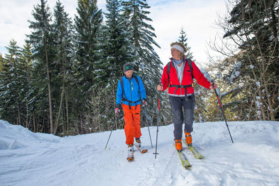 People walking on snow covered land