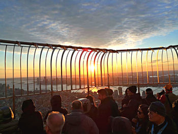 Group of people against sky during sunset