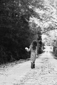 Woman standing on road