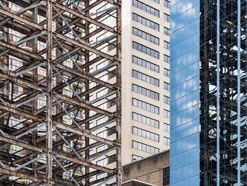 Low angle view of modern glass building in city