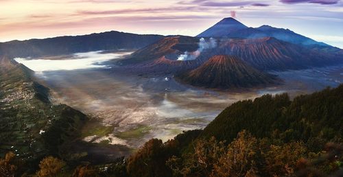 Scenic view of mountains against cloudy sky