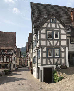 Street amidst buildings against sky