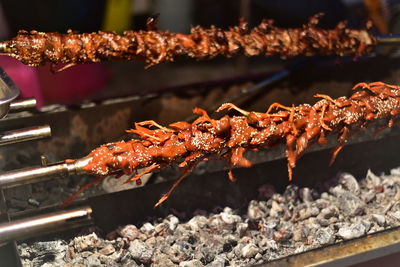 Close-up of meat on barbecue grill