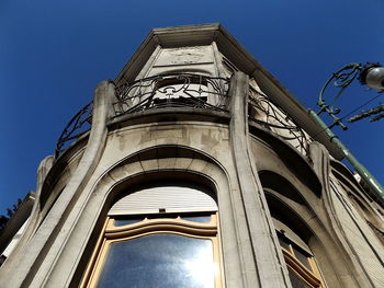 Low angle view of monument against clear blue sky