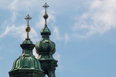 Low angle view of bell tower against sky