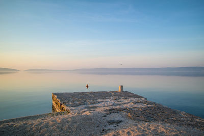 Scenic view of sea against sky at sunset. empty dock. peaceful sea view background. 