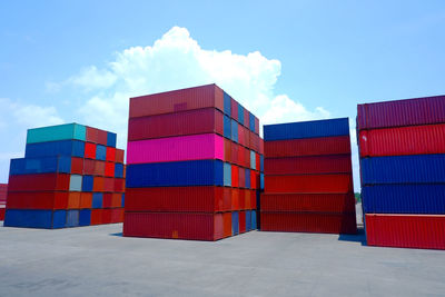 Low angle view of multi colored built structure against blue sky