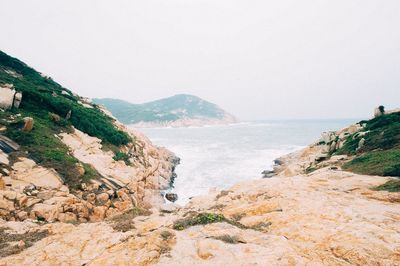 Scenic view of beach against clear sky