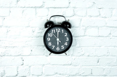 Close-up of clock on wall