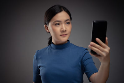 Portrait of man using mobile phone