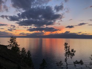 Scenic view of lake against orange sky