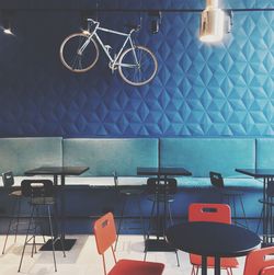 Empty chairs and tables in cafe