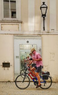 Man riding bicycle in city