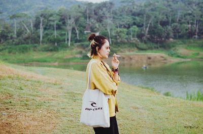 Woman standing on field