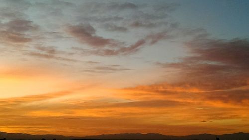 Scenic view of mountains at sunset