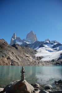 Scenic view of snowcapped mountains against clear sky