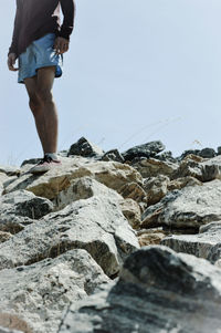 Person standing on rock formation