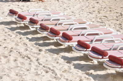 High angle view of deck chairs on beach