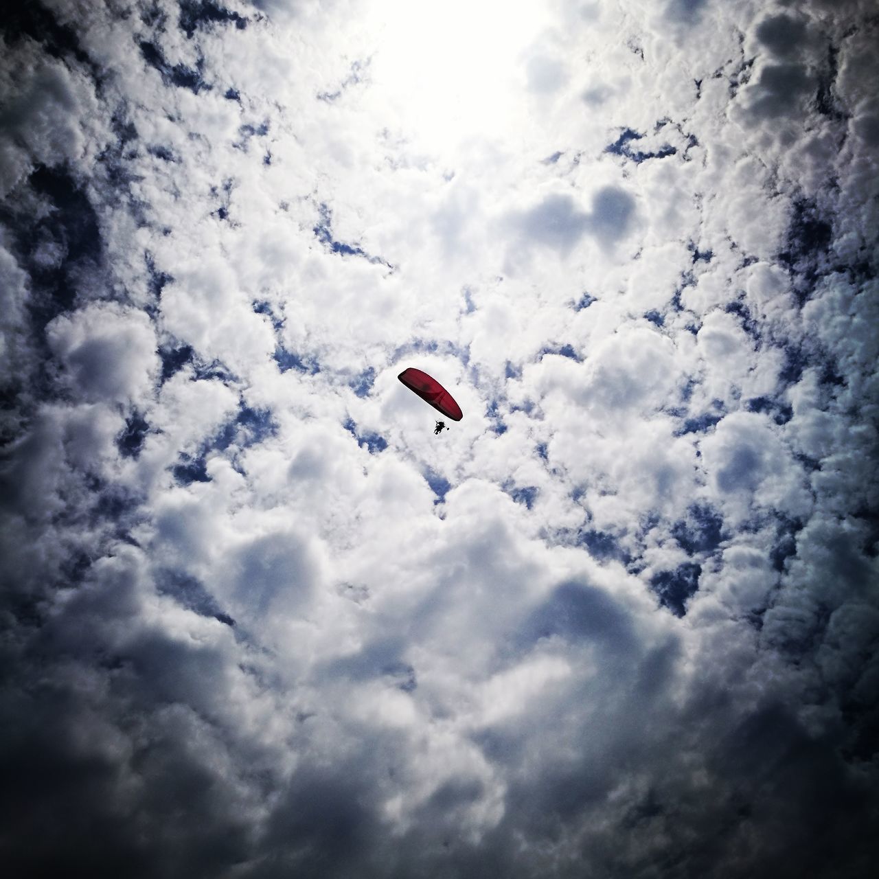 LOW ANGLE VIEW OF PARAGLIDING AGAINST SKY