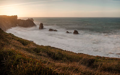 Scenic view of sea against sky during sunset
