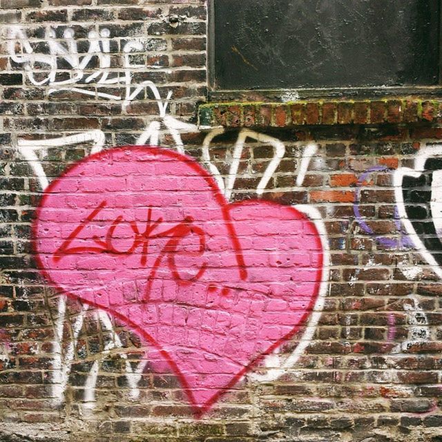 text, western script, red, communication, graffiti, creativity, art, heart shape, love, art and craft, close-up, capital letter, wall - building feature, built structure, architecture, street art, animal representation, ideas, no people, building exterior