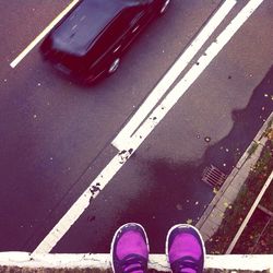 High angle view of people standing on road