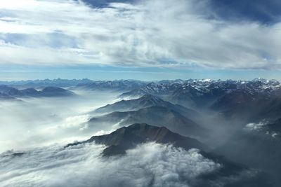 Scenic view of mountains against sky during winter