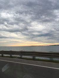 Scenic view of sea against cloudy sky