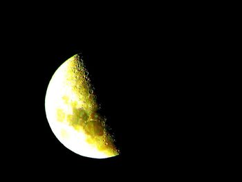 Low angle view of moon against sky at night