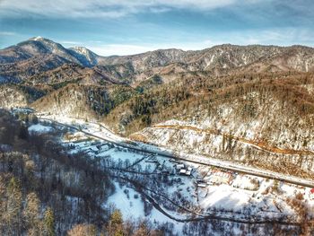 Scenic view of mountains against sky during winter