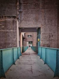 Empty alley amidst buildings