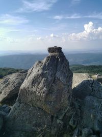 Rock formation on land against sky