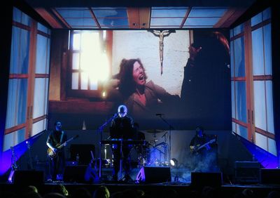 Young woman playing at music concert