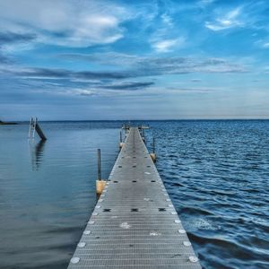 Pier over sea against sky