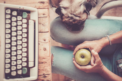 Midsection of man holding fruit