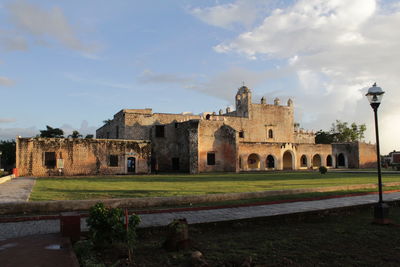 Historic building against cloudy sky