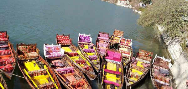 High angle view of multi colored umbrellas by sea