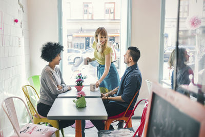 Group of people sitting on table