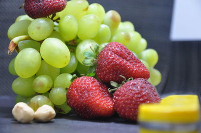 Close-up of grapes in container on table