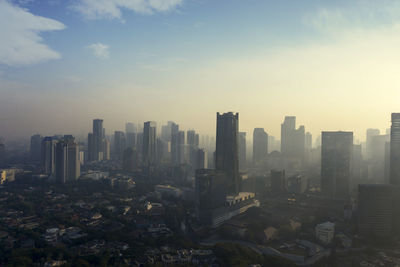 Modern buildings in city against sky