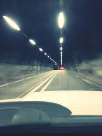 Car moving on road at night