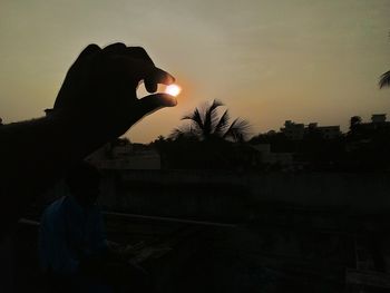 Silhouette of woman at sunset